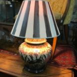 A pottery table lamp and two others (3)