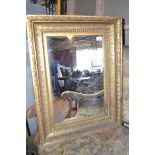A modern gilt wall mirror, 77 x 59 cm, and a carved oak wall mirror (2)