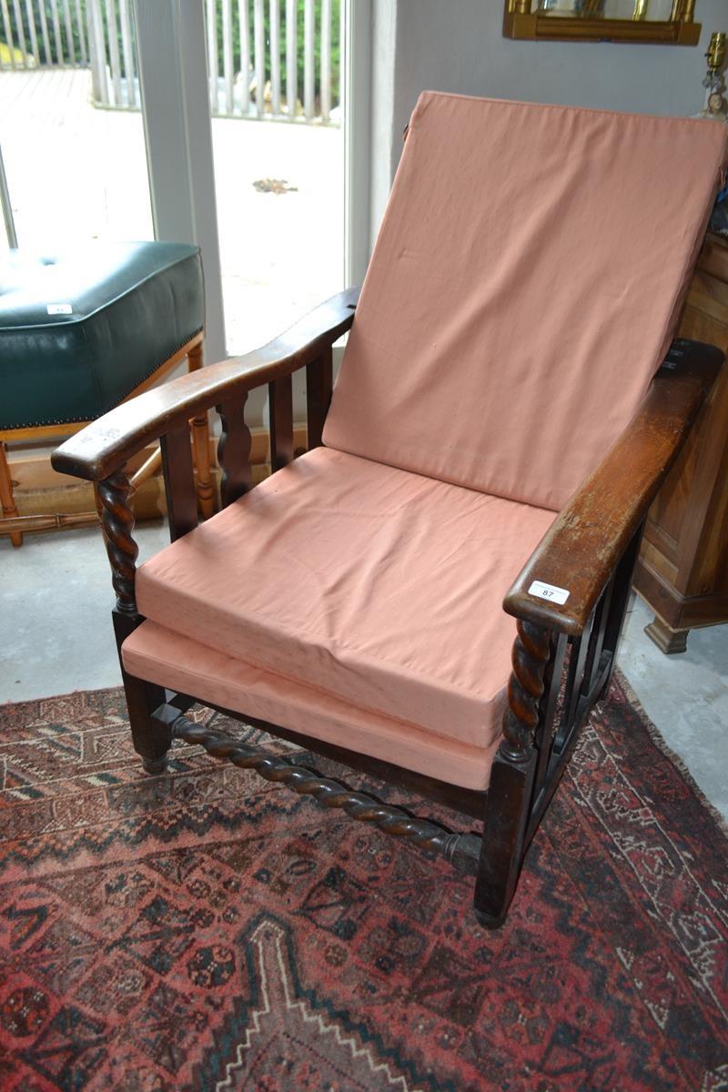An Edwardian gentleman's oak adjustable reclining armchair