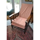 An Edwardian gentleman's oak adjustable reclining armchair