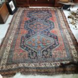 A Kazak style rug, worn, 268 x 183 cm