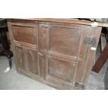 An oak two door cupboard, 121 cm wide