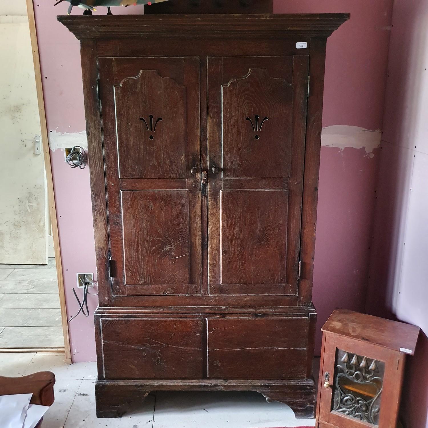 An oak two door cupboard, 105 cm wide x 170 high