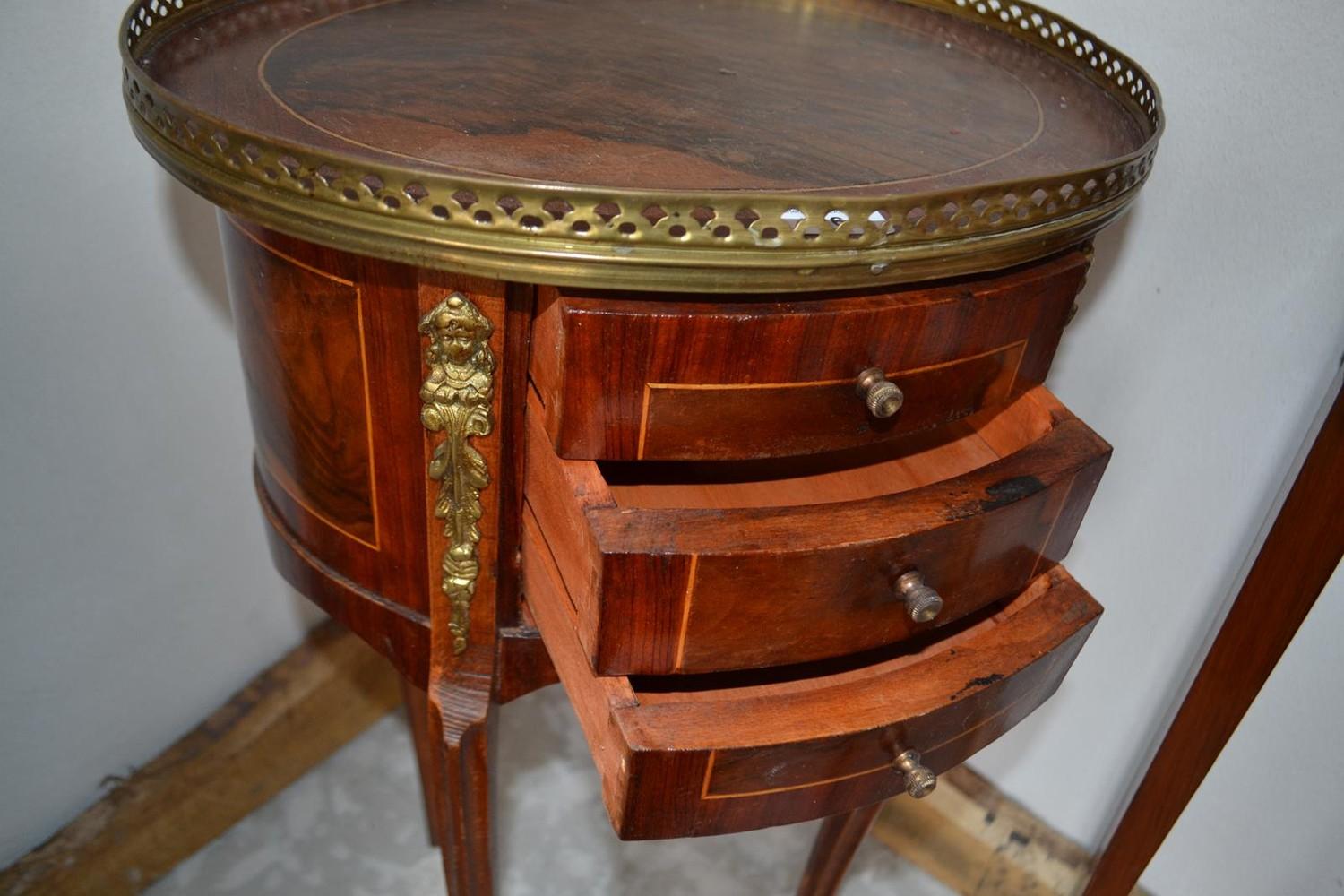 A French oval inlaid bedside chest, with brass mounts, 40 cm wide x 73.5 cm high - Image 3 of 3