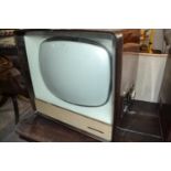 An Ekco television, in a wooden case, 49.5 cm high