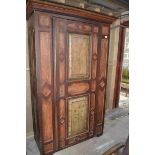 A Continental painted armoire, decorated flowers, 134 cm wide x 203 cm high, cut