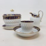 A Worcester porcelain part tea service, with blue band, highlighted in gilt, comprising eleven cups,