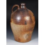 A salt glazed flagon, with two thumb marks to handle, 50 cm high