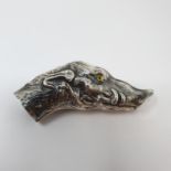 A silver boar head cane handle