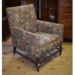 A 19th century mahogany button back armchair, and an early 20th century armchair with turned legs