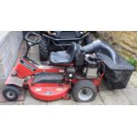 A Snapper ride on petrol garden lawn mower, with a 10 hp Briggs & Stratton engine From a local