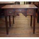 A 19th century oak low boy, having three drawers, on square legs, 78 cm wide, and an oak side table,