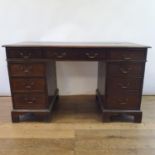 An oak desk, with drawers and a cupboard, 144 cm wide