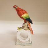 A 19th century Vienna style clock case, with parrot finial, beehive mark to base, 29 cm high, a
