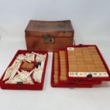 A mah-jong set, in a leather case 146 tiles total. The tile dimensions are 3.2 x 2.2 x 1.5 cm