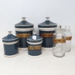 A set of 20th century pharmaceutical jars, two 20 cm high, three 14 cm high, two glass drug jars and