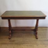 A 19th century mahogany table, on turned supports, united by stretcher, on splayed legs, 110 cm wide