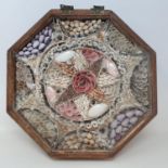 A 19th century sailor's valentine octagonal section, in an oak case, 31 cm wide