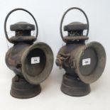 A pair of Lucas King of the Road lamps, no. 72, 35 cm, a brass adjustable two branch candelabrum, 28