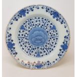 A Dutch Delft plate, decorated in underglaze blue in the Chinese taste, chipped and with some