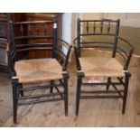 A pair of William Morris Sussex style spindle armchairs (2) The chair, with the less worn arms,
