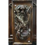 A late Victorian/Edwardian panel, carved in high relief a dogs head, rifle, dead game, horn and