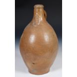 A brown stoneware Belamine, with mask decoration, 39 cm high Report by RB The provenance is the