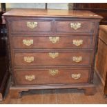 A 19th century oak chest, having two short and three graduated drawers on bracket base, 95 cm wide