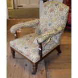 A 19th century armchair, on turned tapering legs