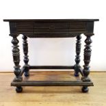 A Continental table, with a frieze drawer, on turned legs, united by stretchers, 100 cm wide