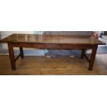 A 19th century farmhouse kitchen table, with a frieze drawer, on square legs,240 cm wide Report by