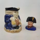 An early 19th century toby jug, 15 cm high, pair of Staffordshire dogs and other 19th century