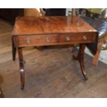 A 19th century mahogany sofa table, with two real and two false drawers, on twin end supports with