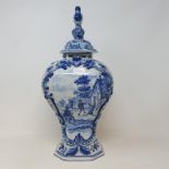 A Delft blue and white vase and cover, 44 cm high