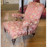 A 19th century armchair, turned mahogany legs