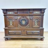 A 17th century oak chest, in two parts, with three drawers, inlaid with mother of pearl and bone, on