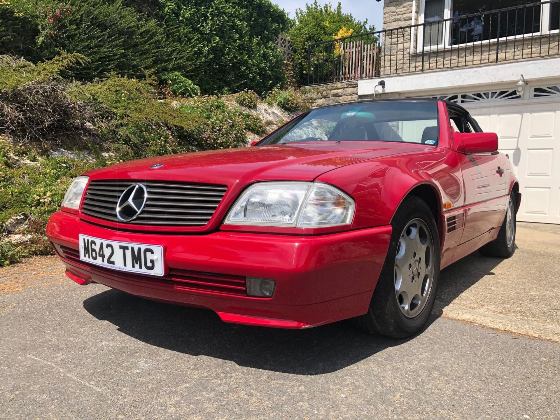 A 1995 Mercedes-Benz 280SL Registration number M642 TMG V5C MOT expires February 2021 Red with a