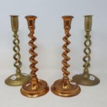 Two pairs of brass barley twist candlesticks, tallest 26 cm high