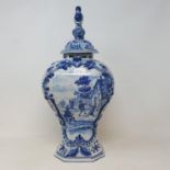 A Delft blue and white vase and cover, 44 cm high