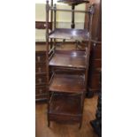 A 19th century mahogany four tier whatnot, with a drawer, on ring turned supports, 45 cm wide