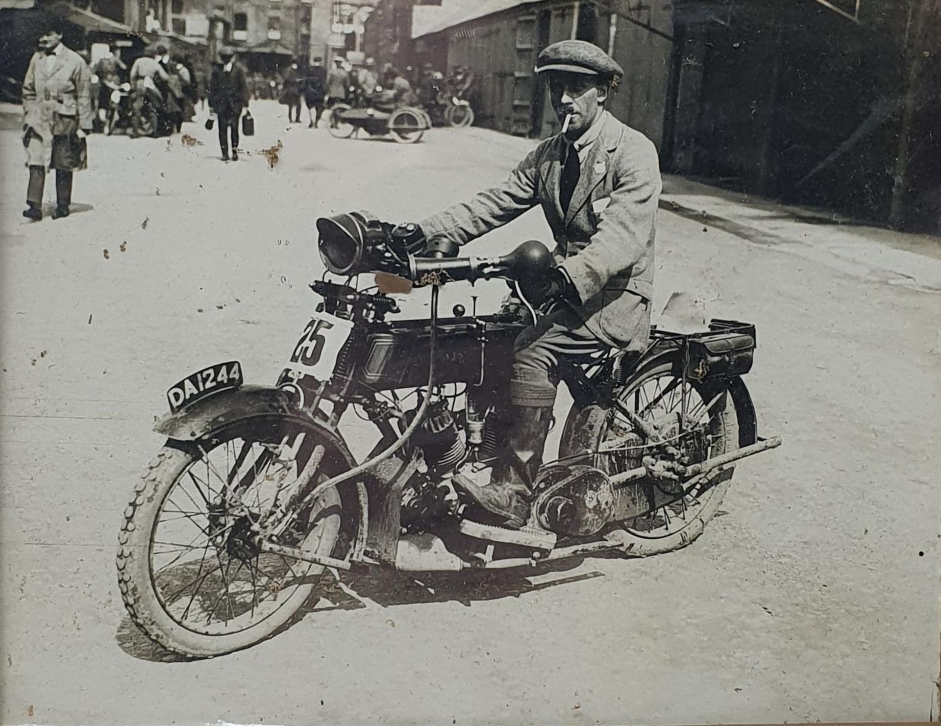 A monochrome photograph, Eric Williams on an AJS (DA 1244), 16 x 20.5 cm Provenance: Being sold - Image 2 of 2