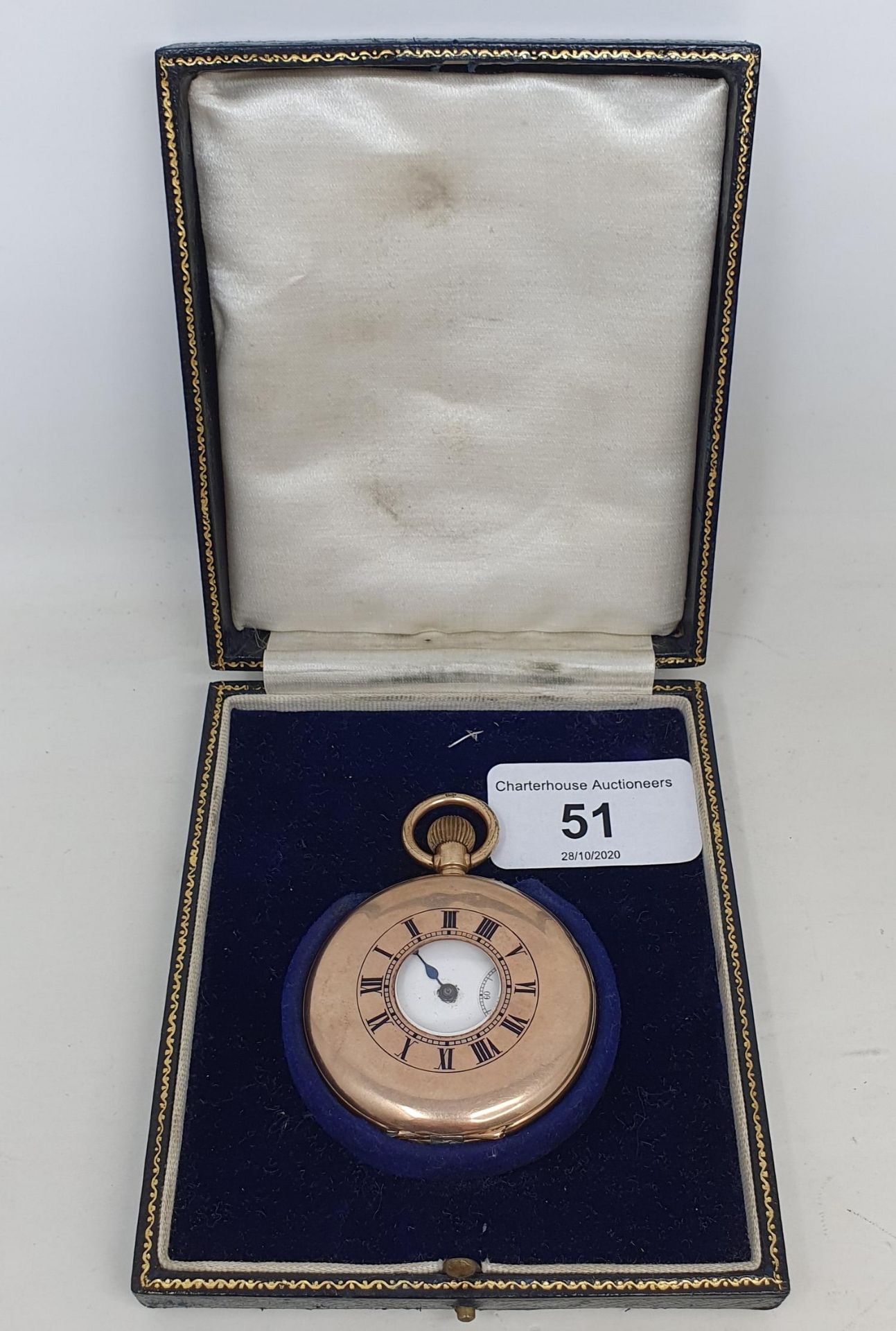 A 9ct gold half hunter pocket watch, the dust cap inscribed 'Presented to Eric J Williams BY THE AJS