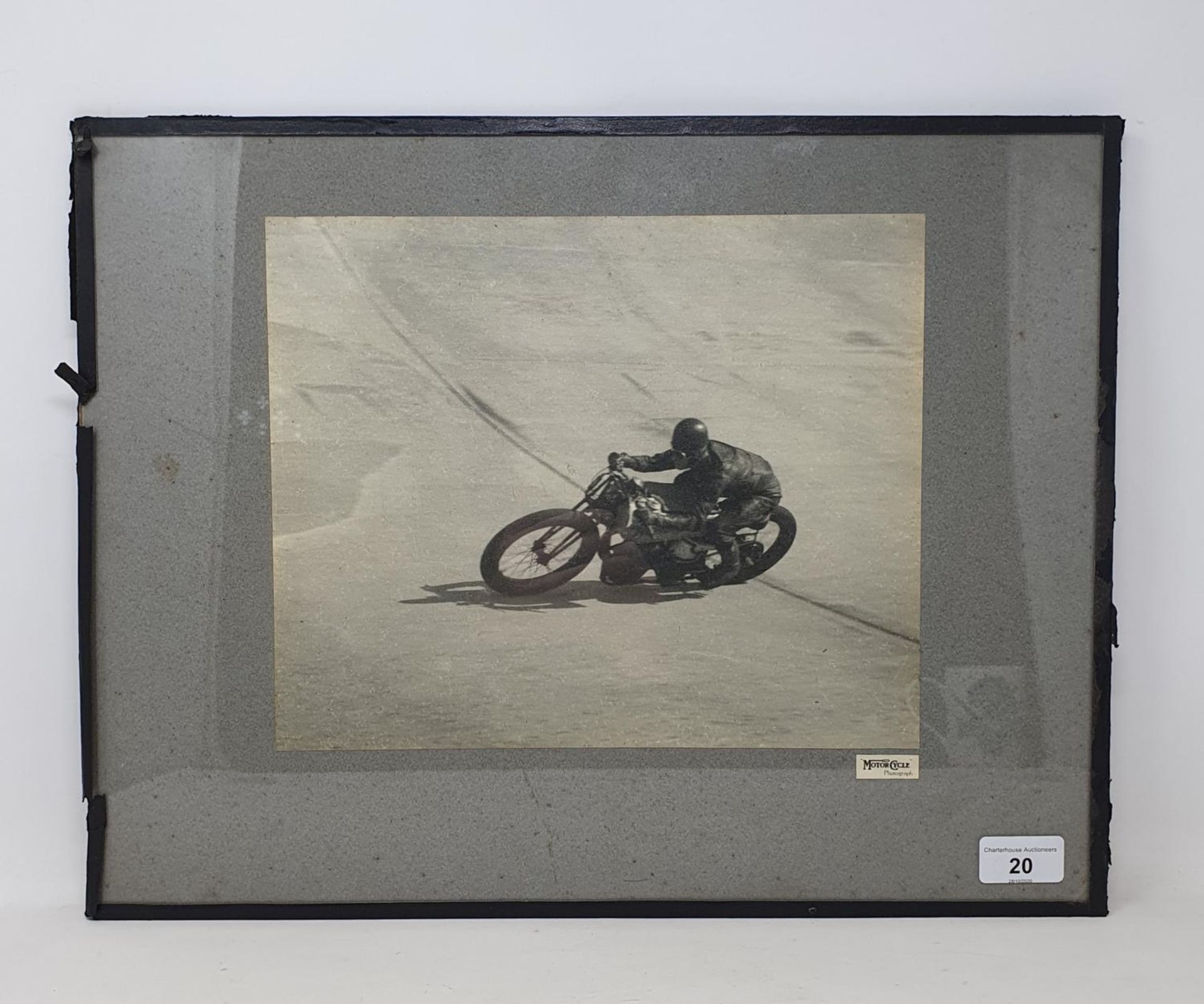 A Motor Cycle monochrome photograph, of a Norton at Brooklands, 23.5 x 29 cm Provenance: Being