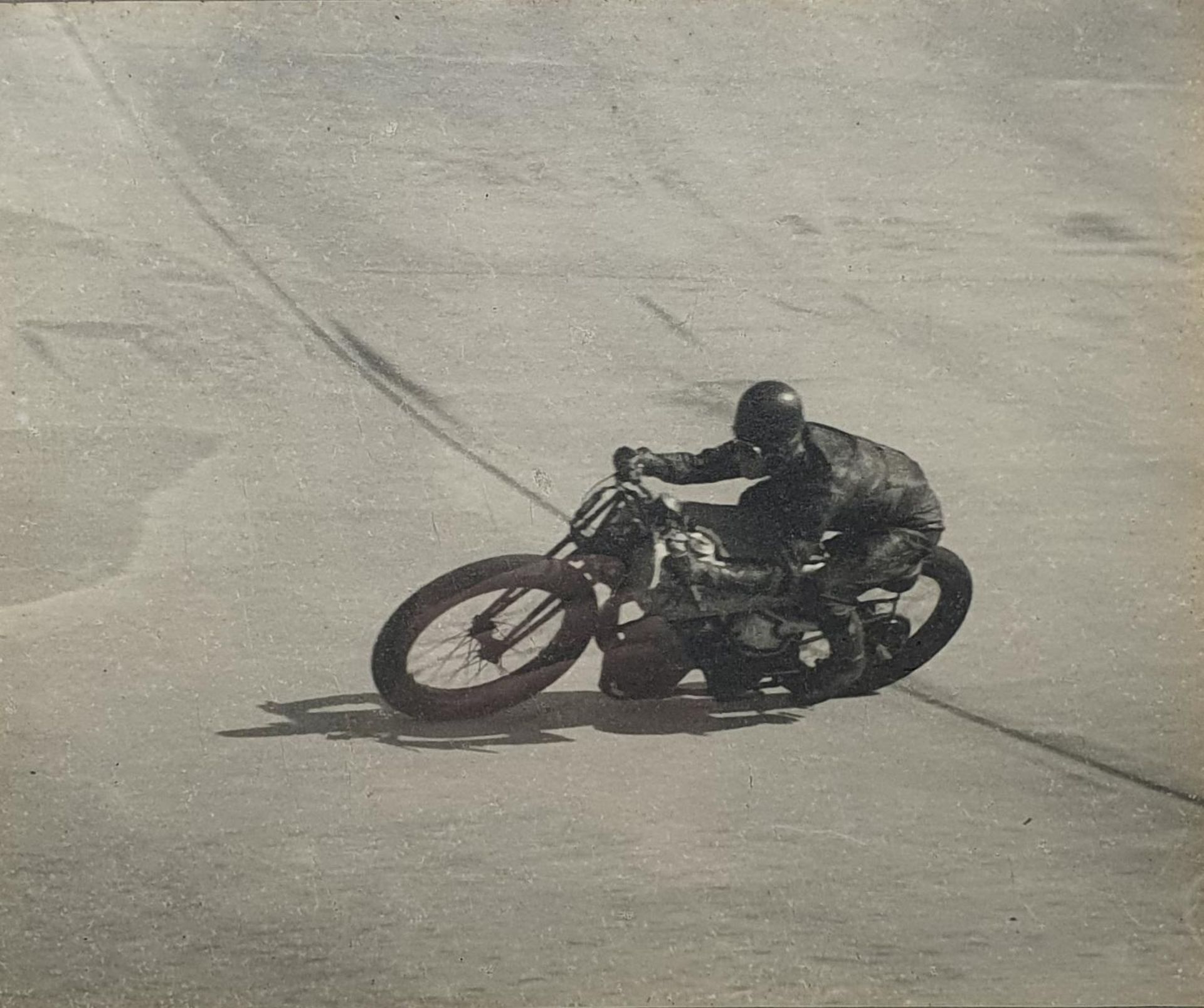 A Motor Cycle monochrome photograph, of a Norton at Brooklands, 23.5 x 29 cm Provenance: Being - Image 2 of 2