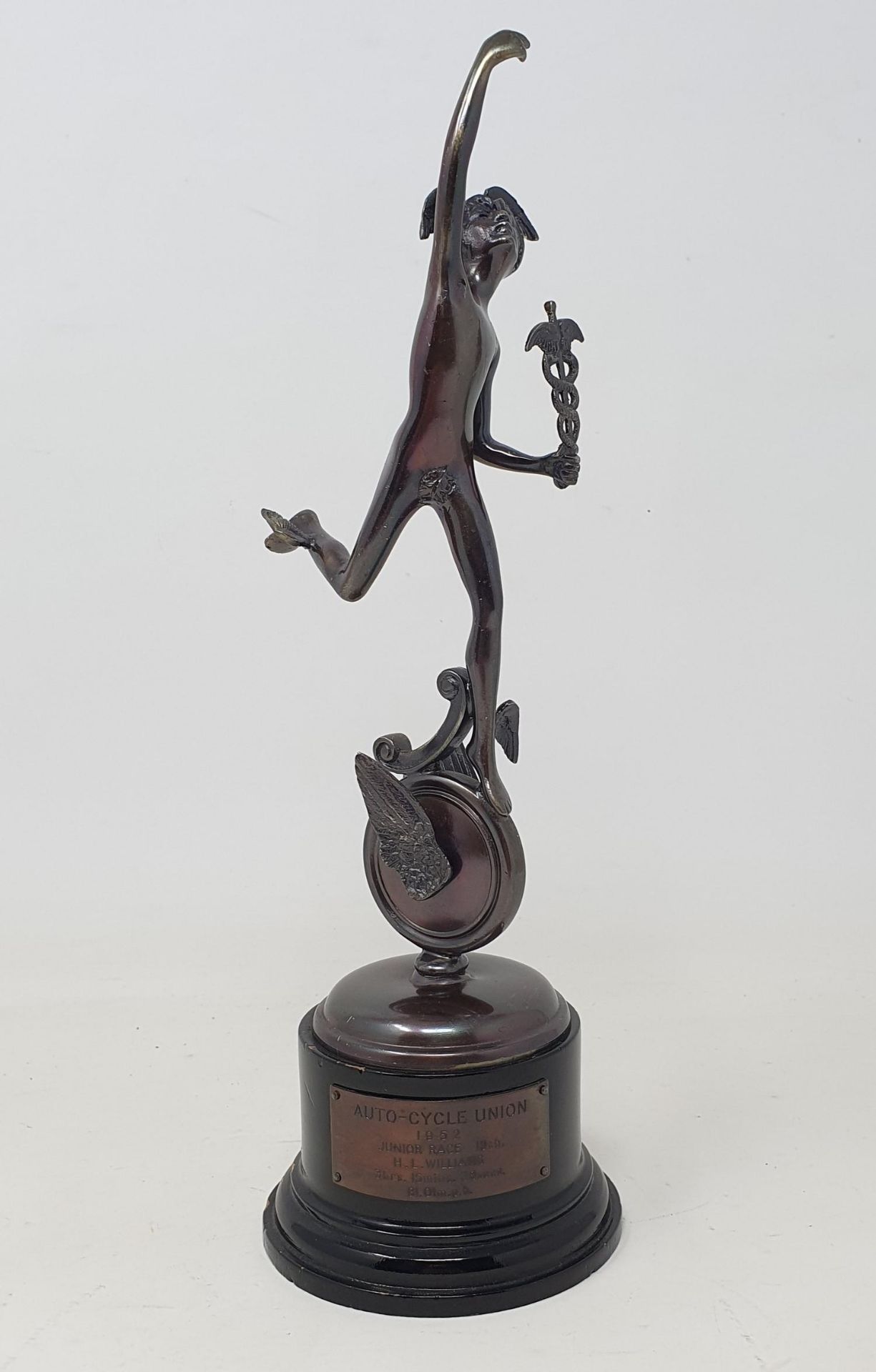 An Isle of Man TT bronze replica trophy, with applied plaque inscribed 'AUTO-CYCLE UNION 1952 JUNIOR