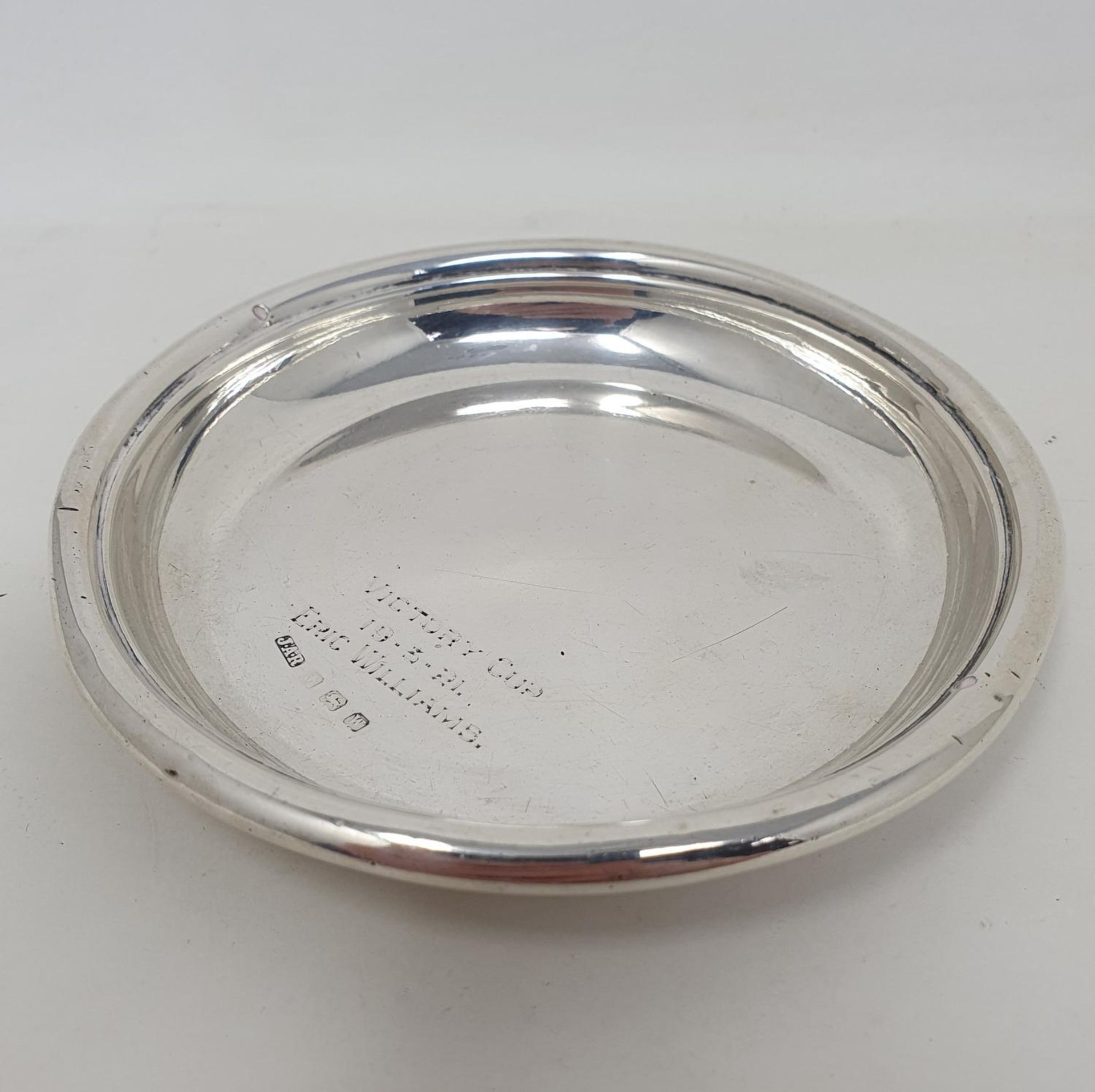 A silver coaster, Victory Cup 19-3-21 Eric Williams, Birmingham 1921, approx. 2.5 ozt, 11 cm