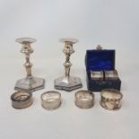 A pair of silver napkin rings, five other silver napkin rings, 3.6 ozt, and a pair of silver