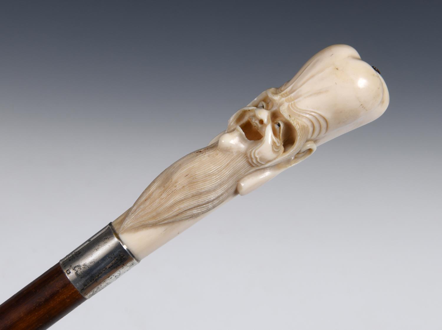 A 19th century walking stick, with a Japanese carved ivory handle in the form of Fukurokuju, on a