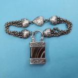 A modern silver coloured metal bracelet, with a padlock clasp Report by JS Note: this is 20th/21st
