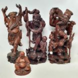 A Chinese carved wood group, of a fisherman and boy, on a rocky base, 41 cm high, other carvings and